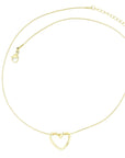 brendoe gold heart necklace worn by a model, styled with a chic outfit to highlight its versatile and elegant design. available now at design on earth