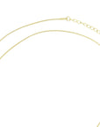 close-up of gold heart pendant necklace, showcasing the fine craftsmanship and luxurious shine, available at Design On Earth