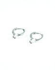 silver earring with a refined diamond, perfect for a modern look.