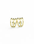 Side angle of a elegant gold colored earrings