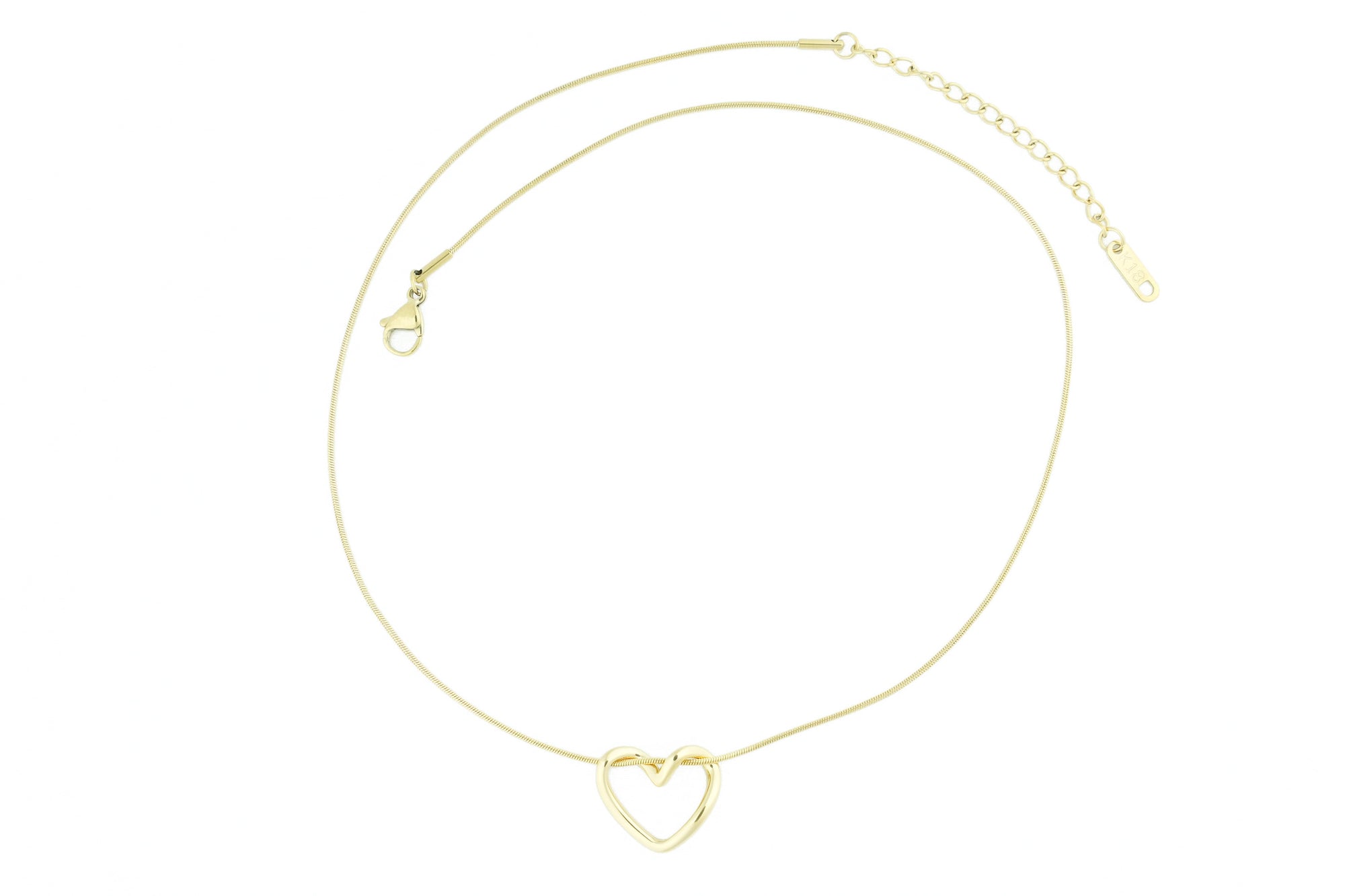 brendoe gold heart necklace worn by a model, styled with a chic outfit to highlight its versatile and elegant design. available now at design on earth