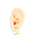 Trendy gold colored earrings by designonearth
in ear on a white background