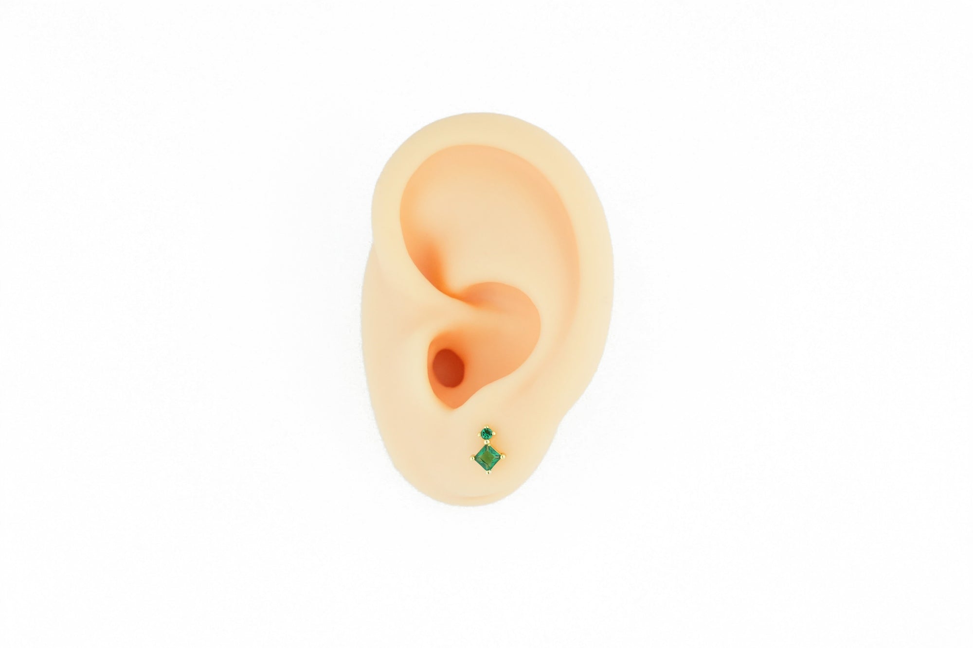 elegantly designed gold stud earring with green accents, ideal for a sophisticated look. nickel free