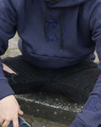 Handmade hoodie in navy with a spacious snap pocket for functional luxury, comfort and perfect for winter, from the brand Purpy