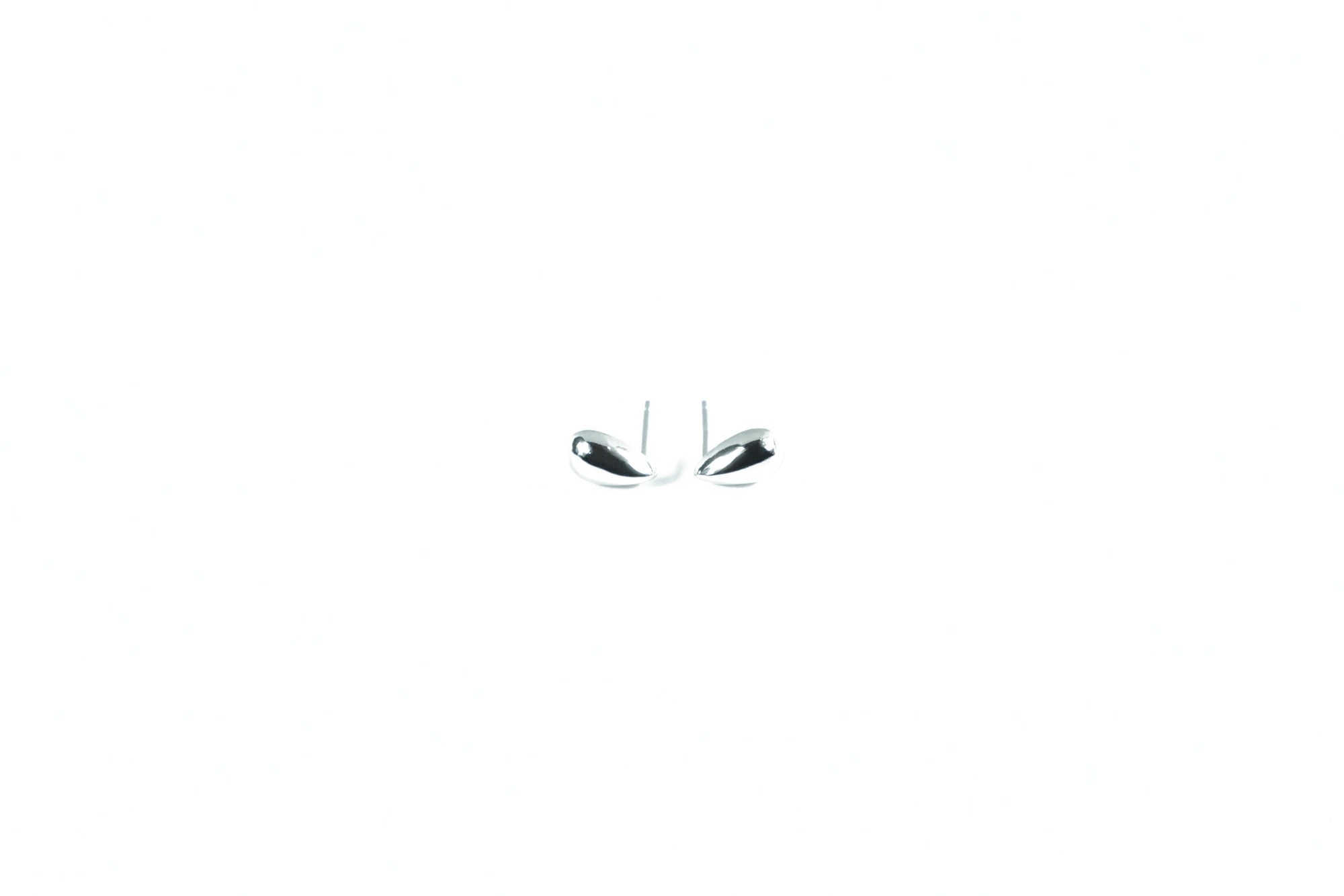 minimalist silver earrings in a subtle drop shape, suitable for any outfit.